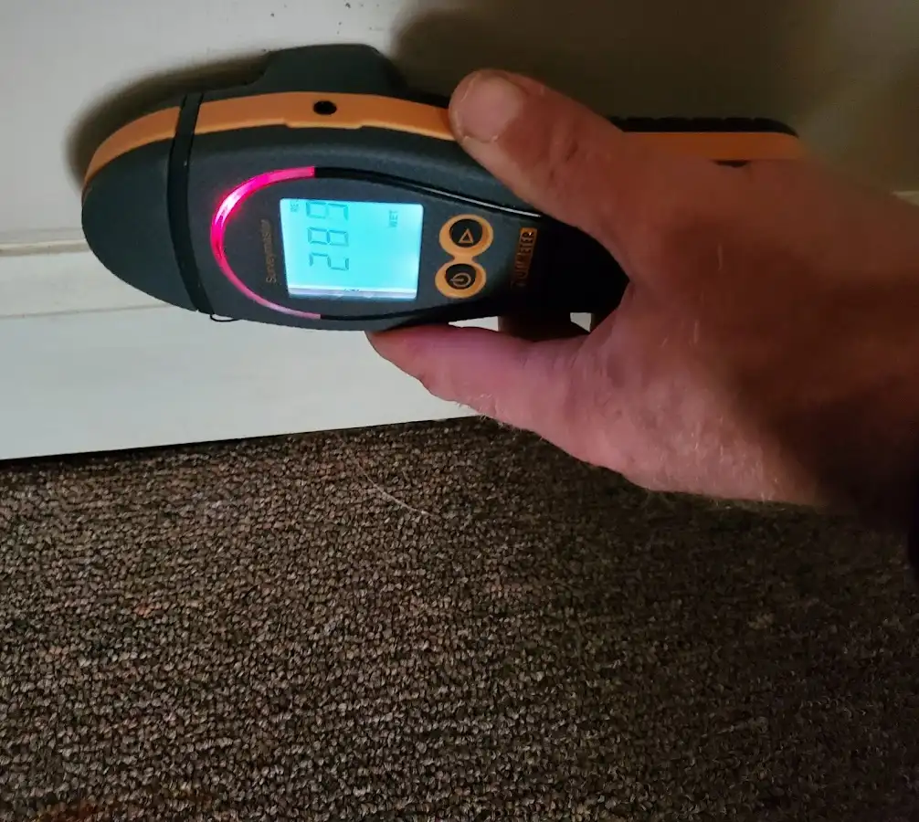 Moisture detection at baseboard during Storm Damage Restoration in California City